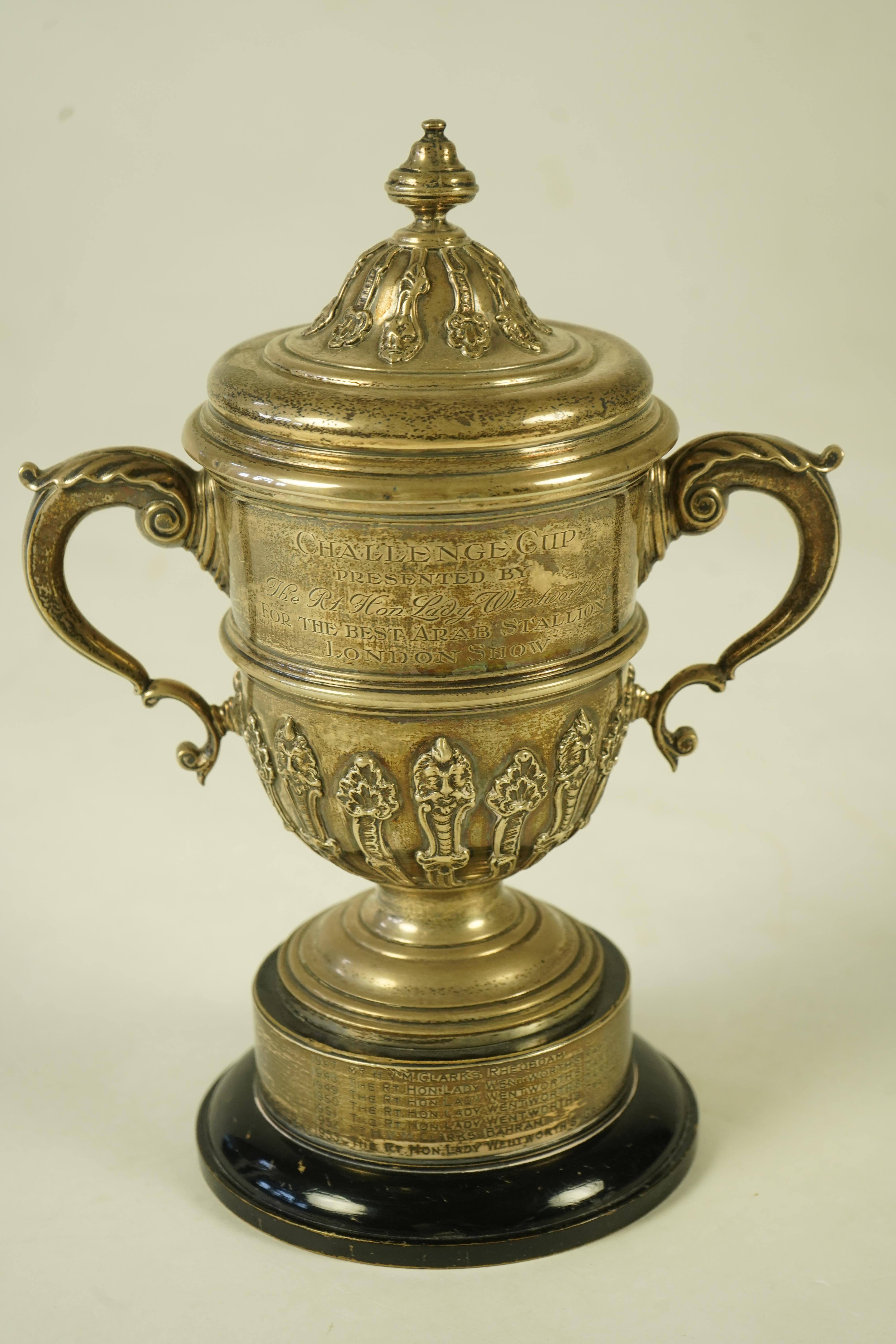 A George V silver two handled presentation cup and cover, by Charles & Richard Comyns, with engraved horse racing inscription relating to 'The Arab Horse Society Challenge Cup Presented by The Rt. Hon. Lady Wentworth for